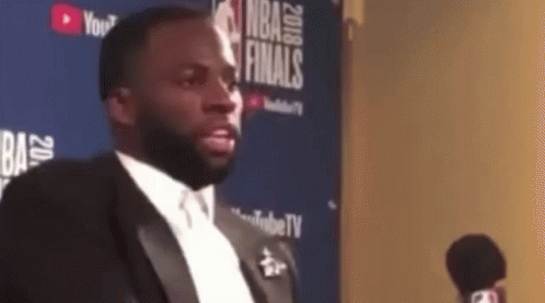 Man in Tuxedo Talking Into Microphone NBA Finals