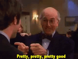 Man in Tuxedo Talking to Another Man