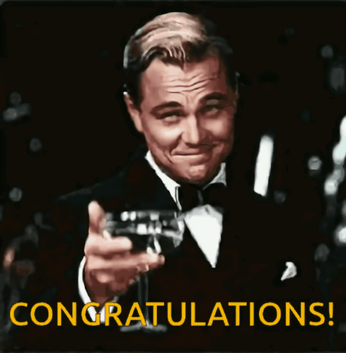 Man In Tuxedo Toasting Wine Saying Congratulations GIF
