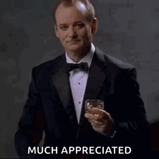 Man in Tuxedo Toasting with Whiskey