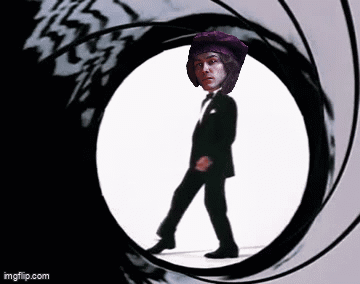 Man In Tuxedo Walking Through Circle Gun Barrel GIF
