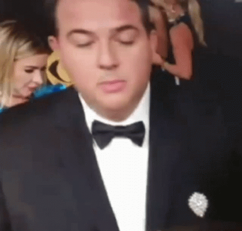 Man in Tuxedo With Bow Tie Looking Down