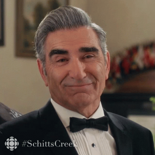 Man in Tuxedo With Bow Tie Smiling With Schitts Creek