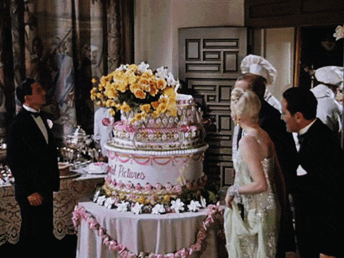 Man in Tuxedo With Cake Saying Gold Pictures
