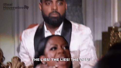 Man in Tuxedo with Laughing Woman Saying The Lies