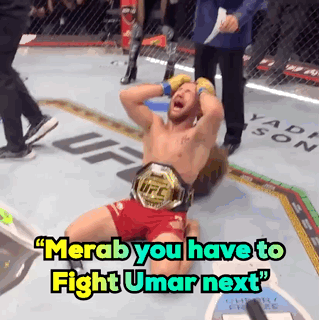 Man in UFC Belt Laying on Ground