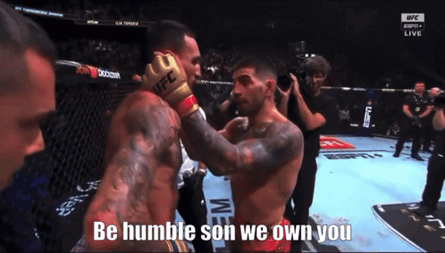 Man In UFC Glove Talks To Man In Boxing Ring GIF