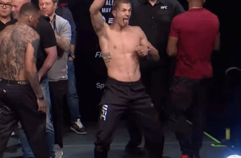 Man In UFC Pants Standing Before Crowd GIF