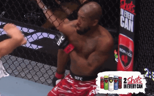 Man in UFC Ring With Monaco Can