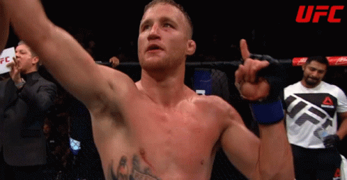 Man In UFC Shirt Holding Hand Up GIF