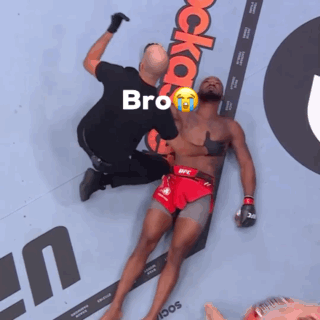 Man in UFC Shorts Lying Down