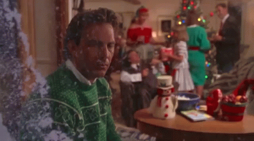Man In Ugly Christmas Sweater By Tree GIF