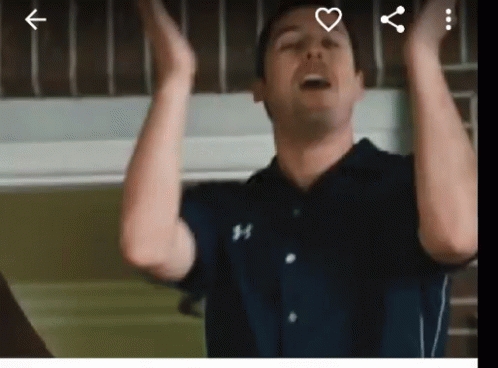 Man in Under Armour Shirt Raising Hands