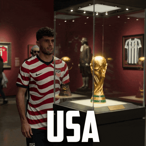 Man in USA Jersey in Front of Trophy