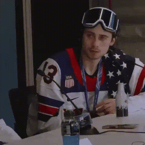 Man in USA Jersey Sitting at Table