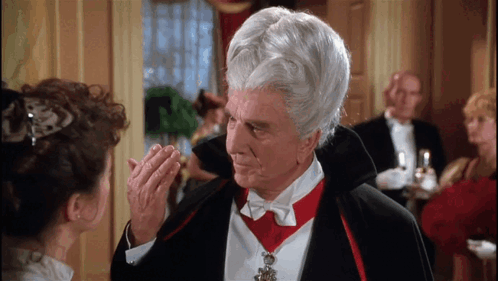 Man In Vampire Costume Looking At Woman GIF