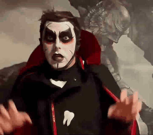 Man in Vampire Costume with Tooth Shirt