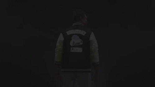 Man In Varsity Jacket Giving OK Sign GIF