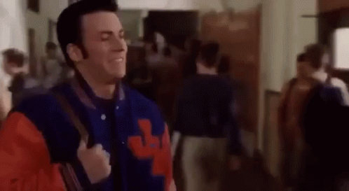 Man In Varsity Jacket Walking GIF