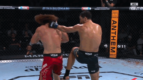 Man in Venum Shorts Kicks Man in Red Shorts