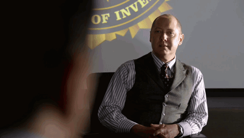 Man In Vest And Tie Before Department Of Investigation Sign GIF