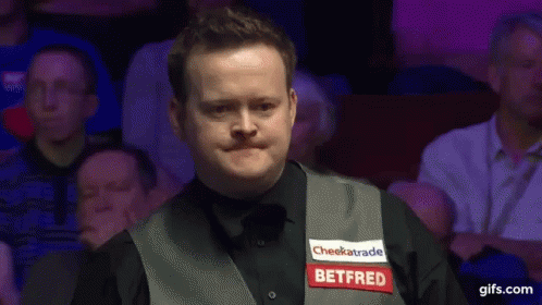 Man in Vest Saying Betfred in Front of Crowd