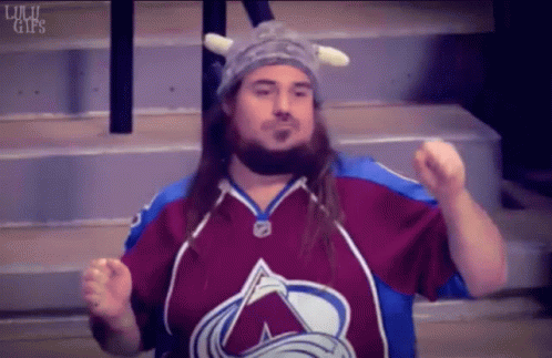 Man in Viking Hat and Avalanche Jersey Fist Pump