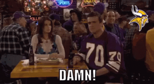 Man In Vikings Jersey Sitting With Woman And Beer GIF