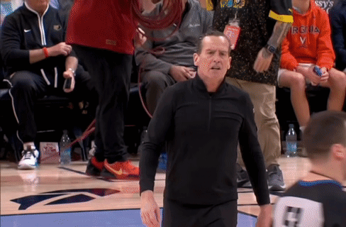 Man in Virginia Shirt on Basketball Court