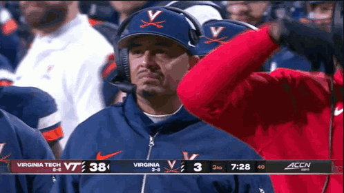 Man in Virginia Tech Hat Watching Game