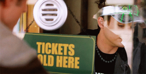 Man in Visor Facing Sign Tickets Old Here