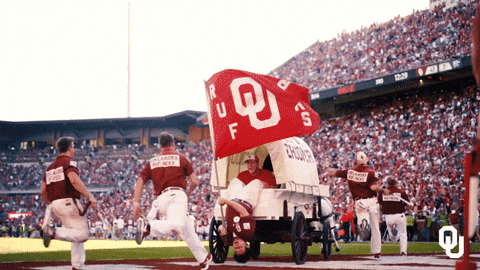 Man in Wagon With OU Flag
