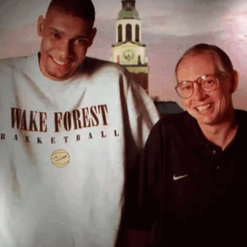 Man In Wake Forest Shirt Next To Man With Glasses GIF