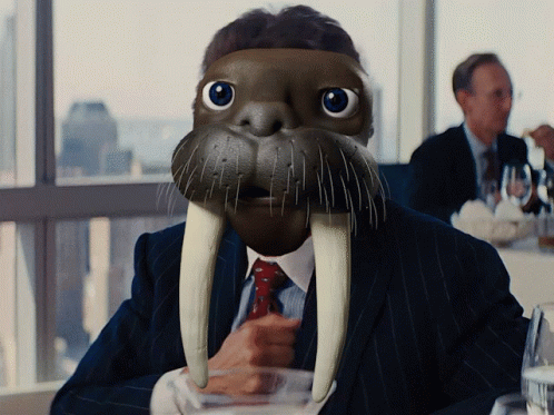 Man in Walrus Mask Holding Glass