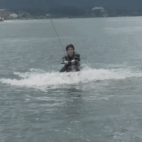 Man in Wetsuit Riding Wakeboard