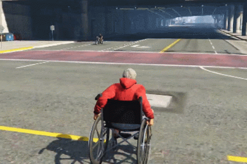 Man In Wheelchair Driving Down Street GIF