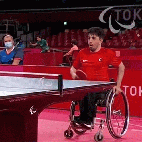 Man in Wheelchair Playing Ping Pong