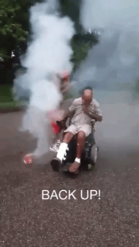 Man in Wheelchair With Cast Smoking
