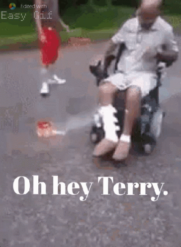 Man in Wheelchair With Leg Bandage Pushed by Another