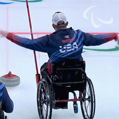 Man In Wheelchair With USA Jacket GIF
