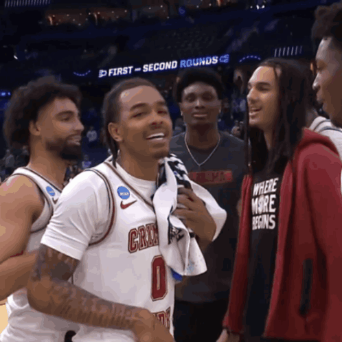 Man In Where More Begins Shirt Talking To Basketball Player GIF