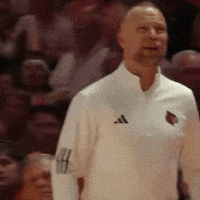 Man in White Adidas Jacket in Front of Crowd