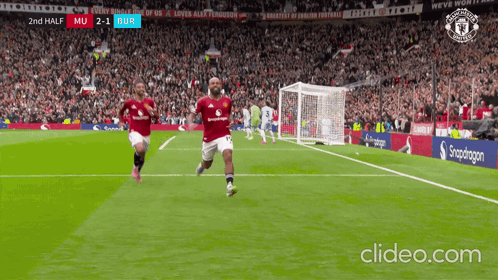 Man in White Adidas Jacket Stands Before Crowd