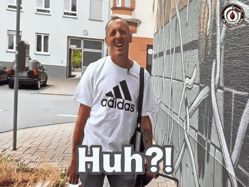 Man in White Adidas Shirt Says Huh