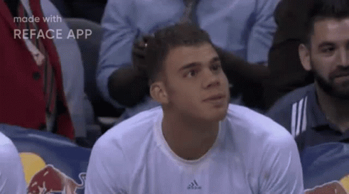 Man in White Adidas Shirt Watching Basketball