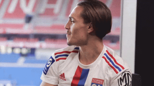 Man in White Adidas Shirt with Olympique Lyonnais
