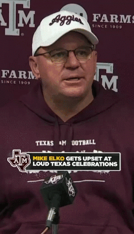 Man in White Aggie Hat at Microphone