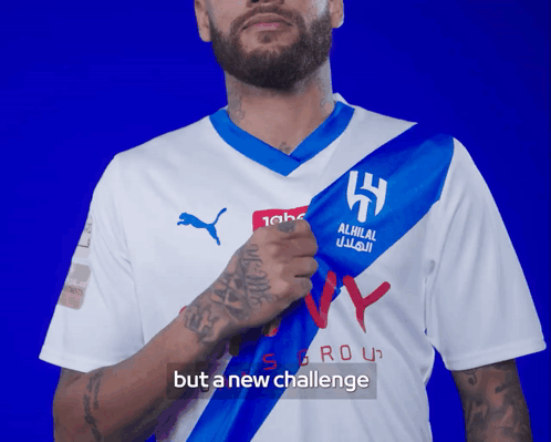 Man in White and Blue Alhilal Shirt