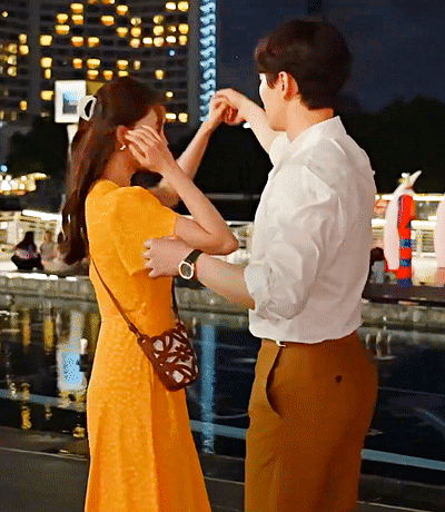 Man in White and Brown Dancing with Woman in Orange