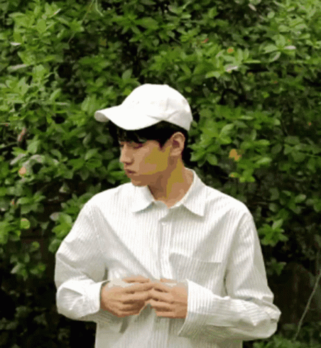 Man in White Baseball Cap and White Striped Shirt